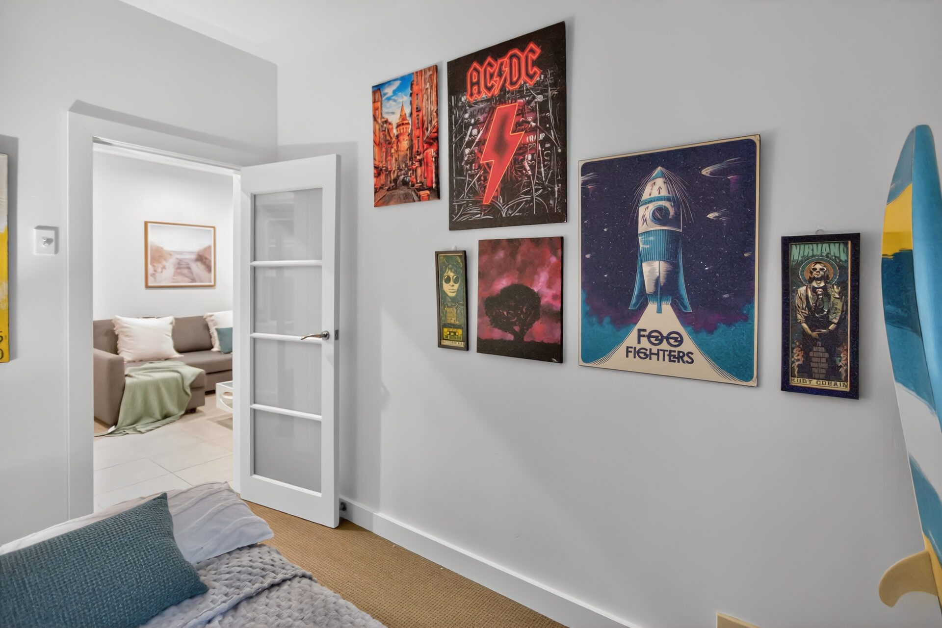 Music poster wall connecting bedrooms